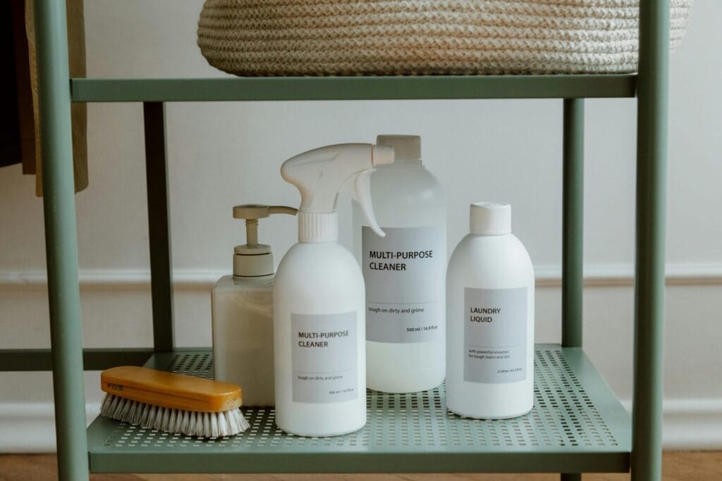 A minimalist display of cleaning products on a shelf, perfect for home organization themes.